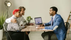 Specializing in recruiting for the insurance industry-advisor discussing options with a couple