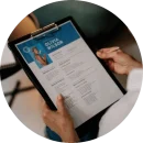 Person holding a curriculum vitae